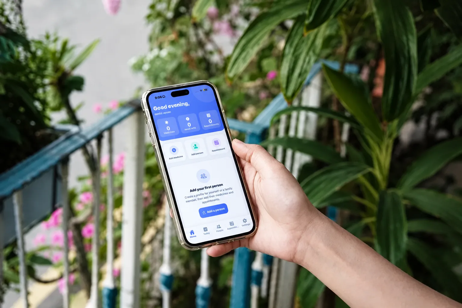 Carepilot mobile app held in hand outdoors